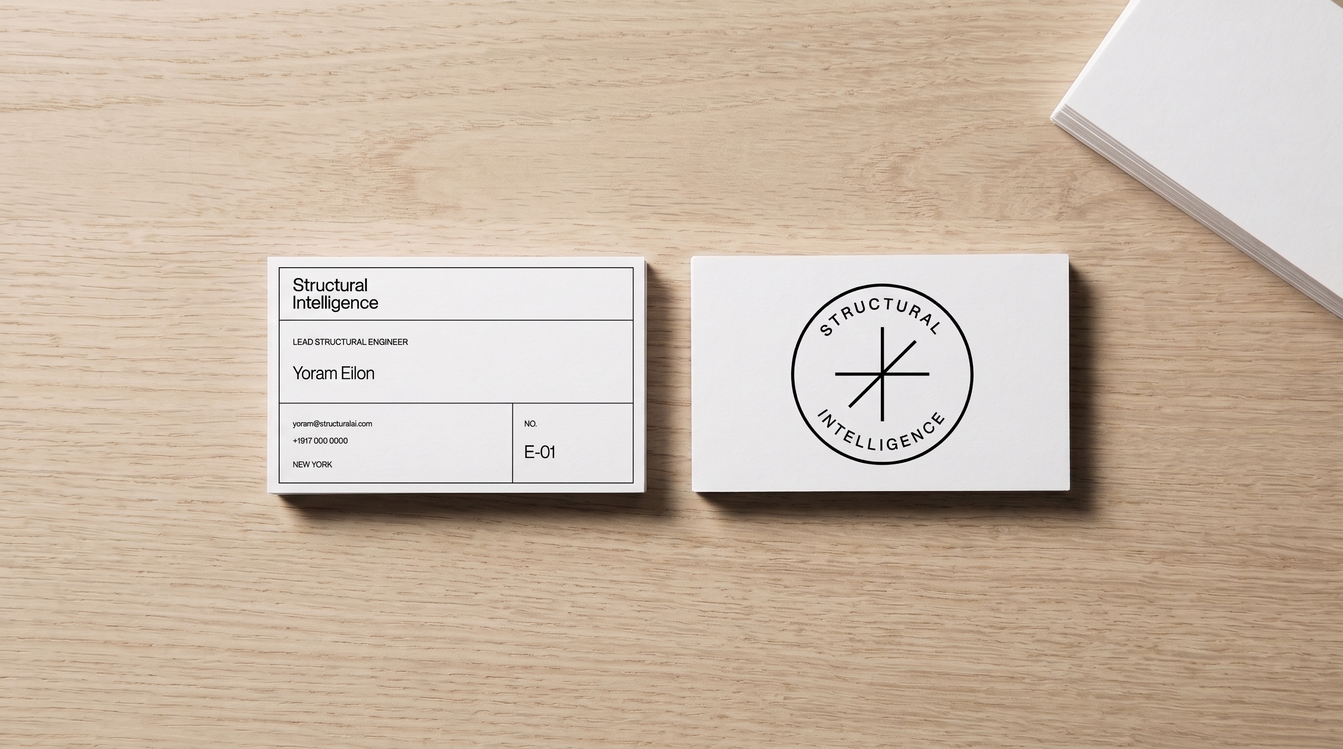 Two cards on the oak, printed as the front and the back