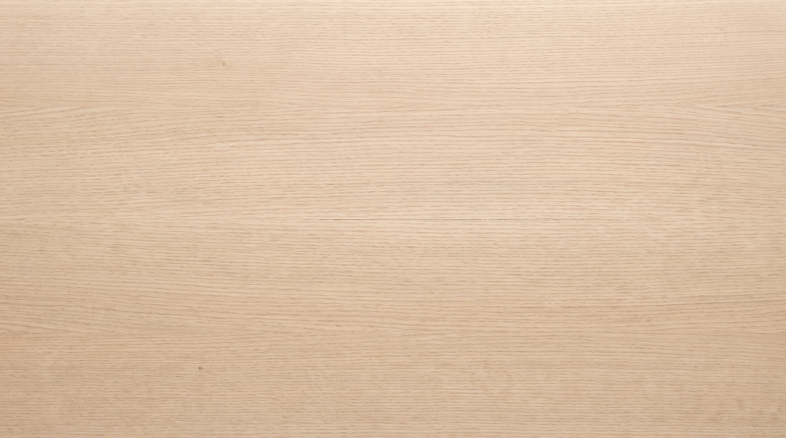The top of a solid white oak table, straight down